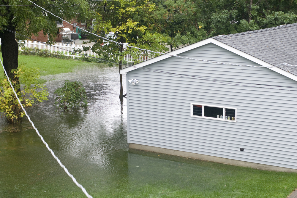 A home with substantial flooding around it.